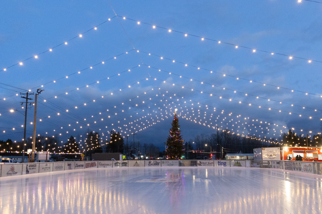 Photo of an ice rink with lights above it